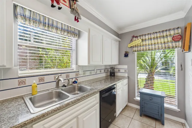 a kitchen with counter top space cabinets and stainless steel appliances