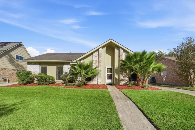 a view of a house with a yard porch and sitting area