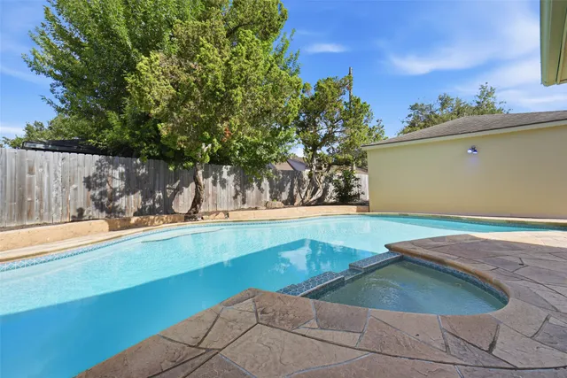 a view of a patio with couches and potted plants