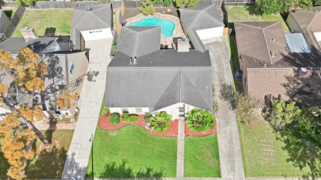 a view of a swimming pool with a patio