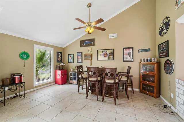 a dining room with furniture and a window
