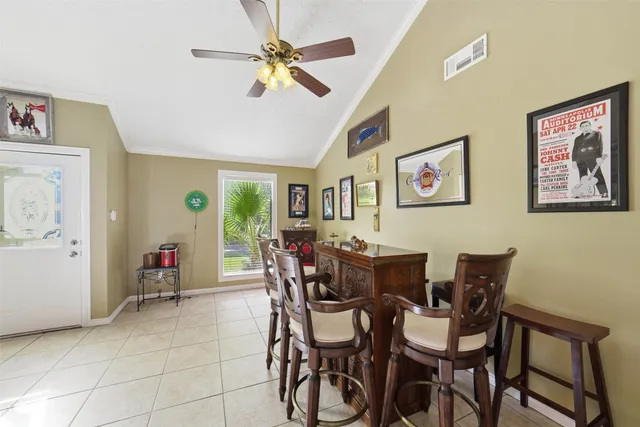 a dining room with furniture and window