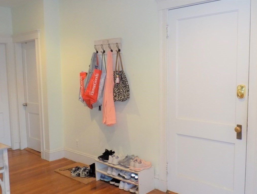 19 University Road, Unit 3 Brookline, MA 02445 - Photo 3 of 16 a bathroom with a shower curtain and a sink