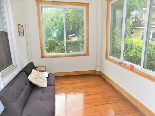 a view of a room with a large window