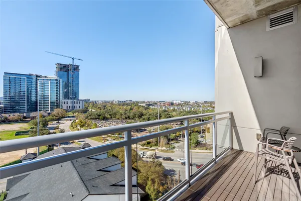 a view of balcony with furniture