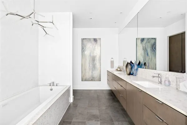 a bathroom with a bathtub and a sink