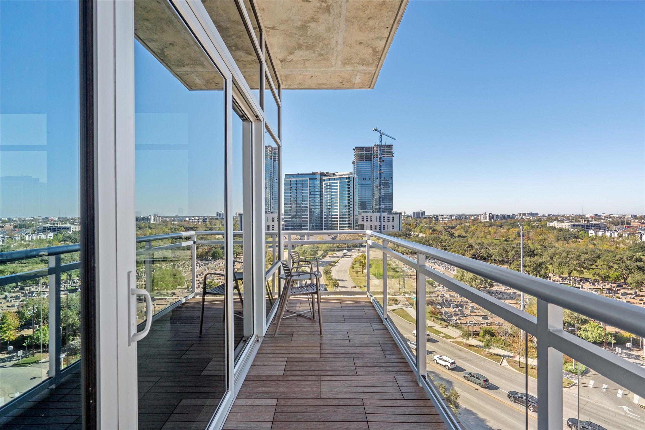 3331 D'Amico Street, Unit 904 Houston, TX 77019 - Photo 3 of 21 Extending seamlessly from the living room, this spacious balcony offers a perfect fusion of luxury and relaxation. With panoramic views stretching across the cityscape and lush green spaces below, it provides an ideal retreat for morning coffee or evening sunsets.