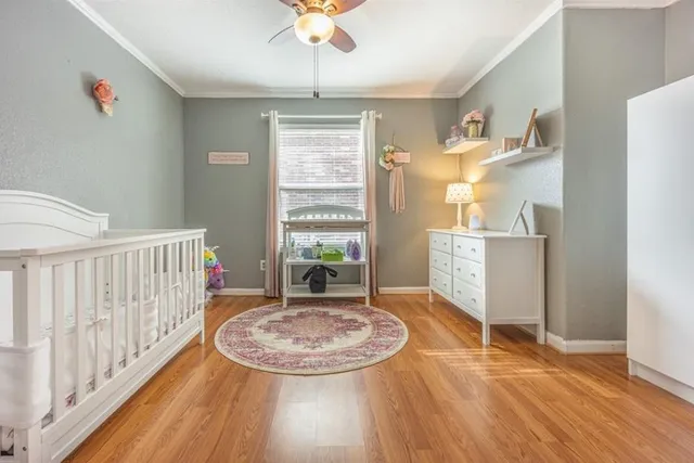 a view of a livingroom with furniture wooden floor and window