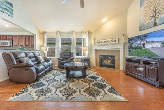 a living room with furniture and a fireplace