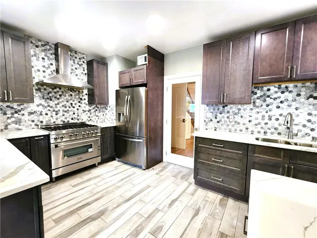 a bedroom with a large bed and a large window