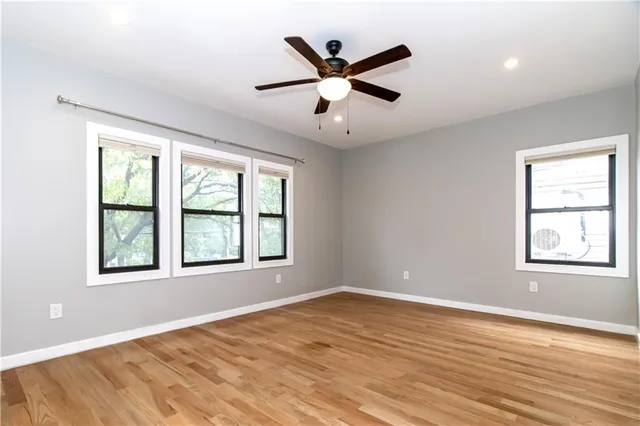 a bedroom with furniture and window