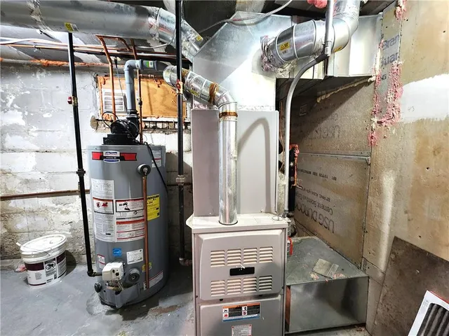 a view of backyard with potted plants and a chair