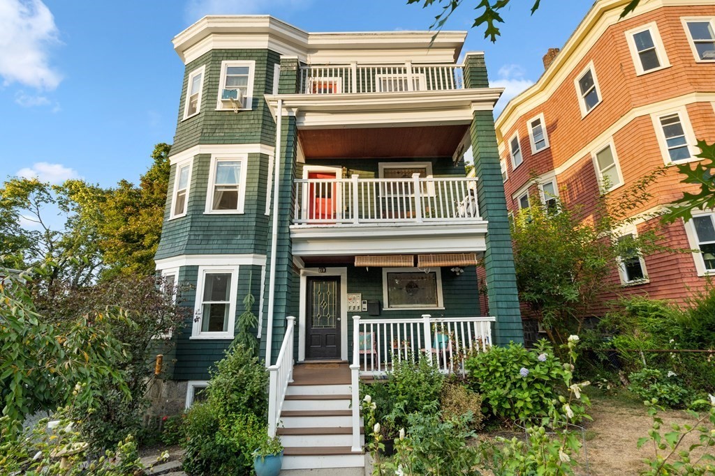 70 Montebello Road, Unit 1 Boston, MA 02130 - Photo 1 of 20 a front view of a house with a yard