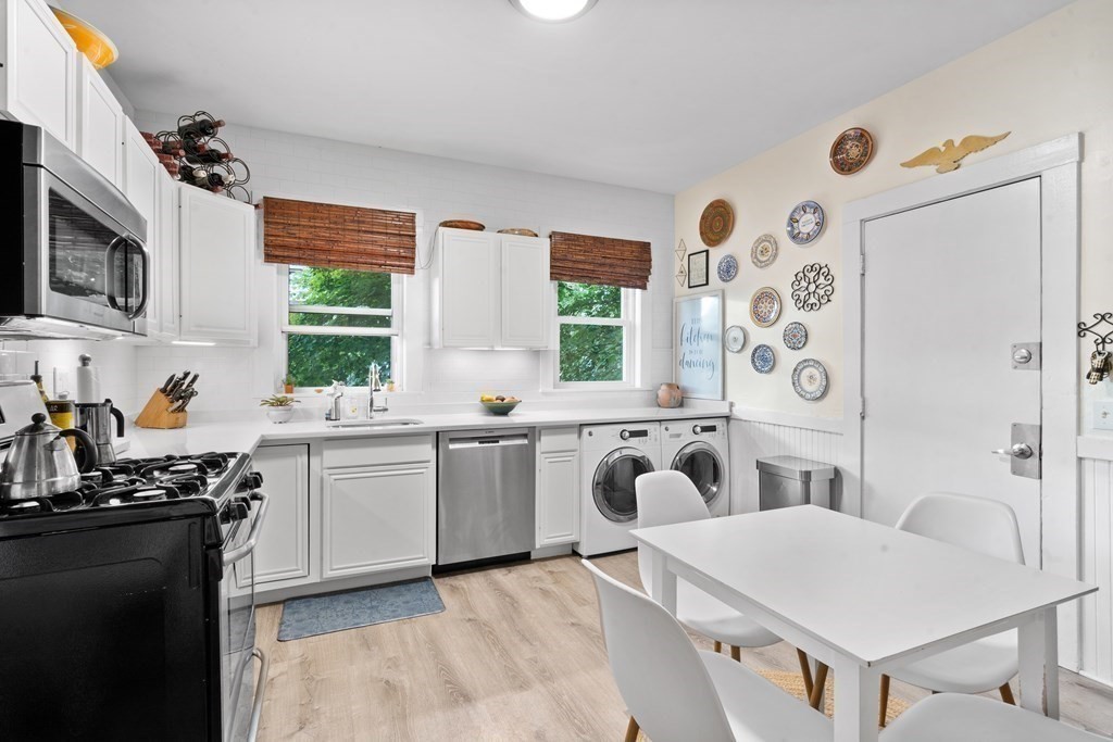 70 Montebello Road, Unit 1 Boston, MA 02130 - Photo 3 of 20 a kitchen with a sink stove and microwave