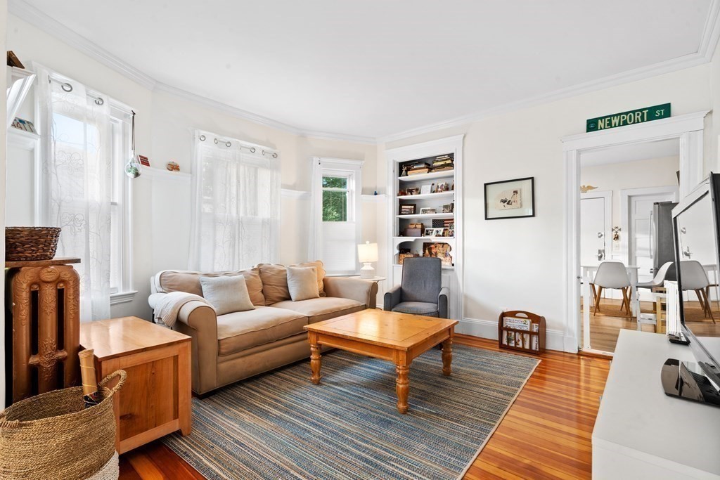 70 Montebello Road, Unit 1 Boston, MA 02130 - Photo 7 of 20 a living room with furniture a rug and a table