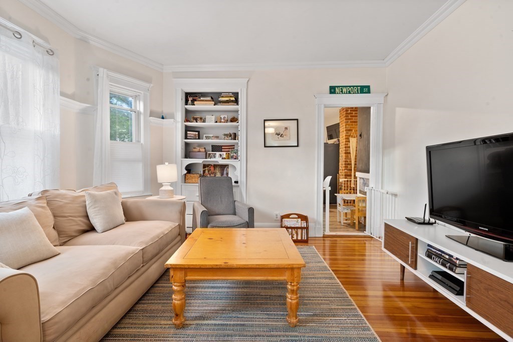 70 Montebello Road, Unit 1 Boston, MA 02130 - Photo 8 of 20 a living room with furniture and a flat screen tv