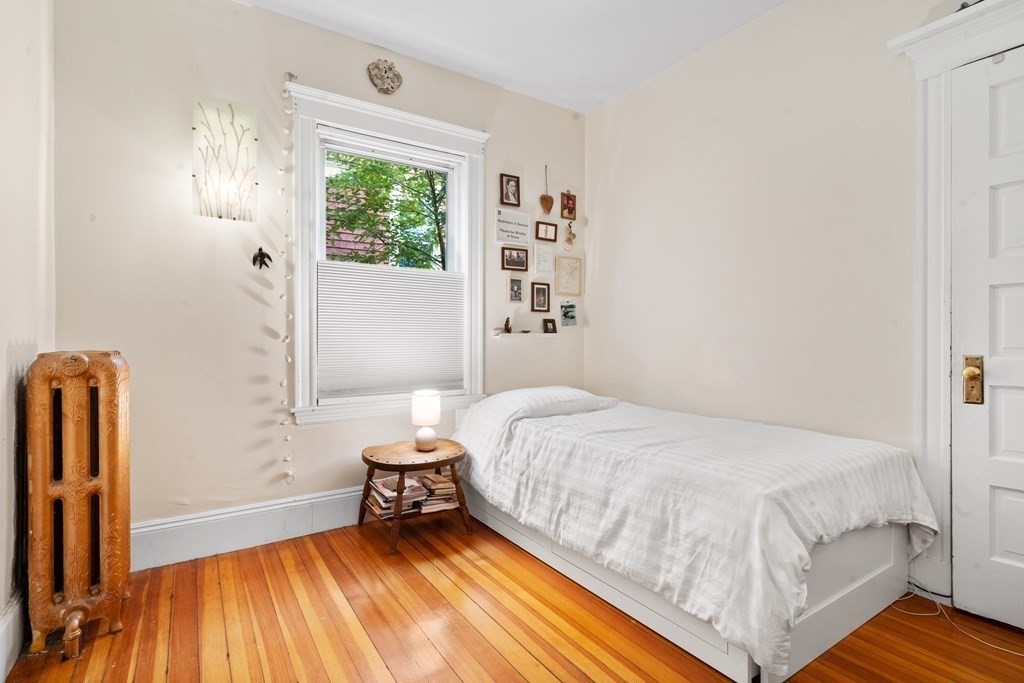 70 Montebello Road, Unit 1 Boston, MA 02130 - Photo 10 of 20 a bedroom with a bed and a window