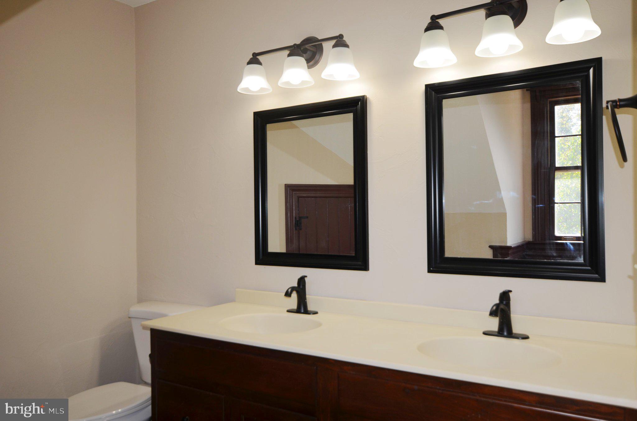 3414 Trone Road Glenville, PA 17329 - Photo 27 of 40 Elegant dual-sink bathroom retreat.