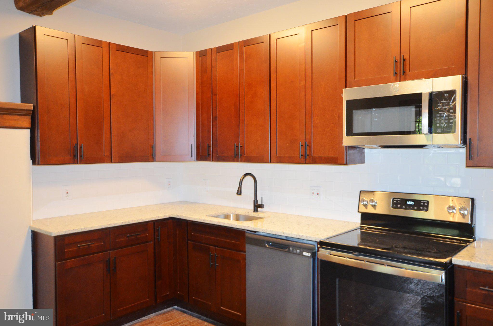 3414 Trone Road Glenville, PA 17329 - Photo 37 of 40 Modern kitchen with rich wood cabinetry.
