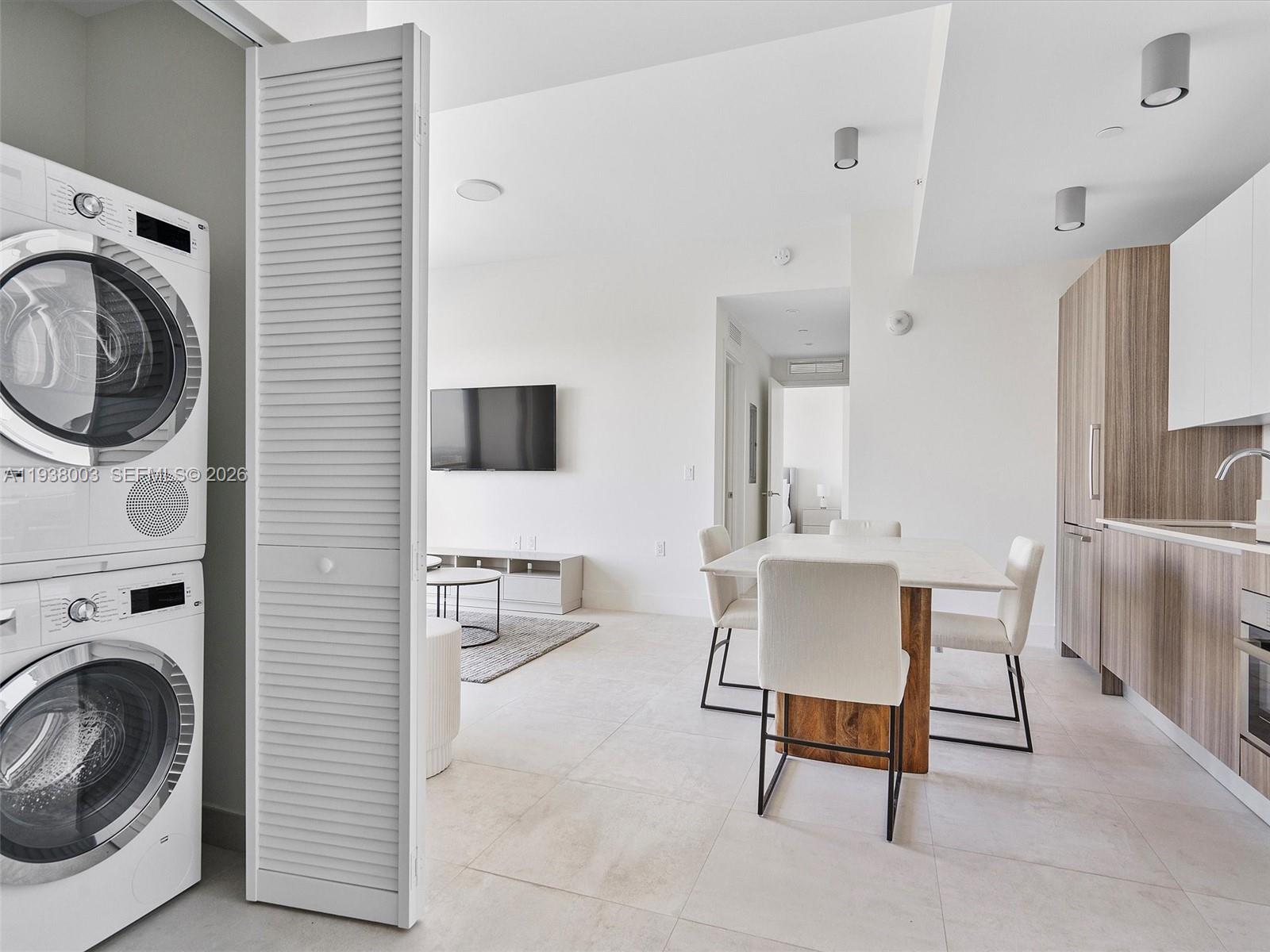 239 Southwest 9th Street, Unit 2003 Miami, FL 33130 - Photo 27 of 52 a view of a hallway with washer and dryer