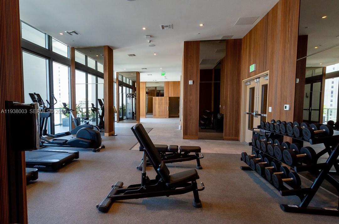 239 Southwest 9th Street, Unit 2003 Miami, FL 33130 - Photo 4 of 52 a view of a room with gym equipment