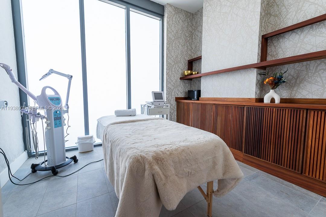 239 Southwest 9th Street, Unit 2003 Miami, FL 33130 - Photo 10 of 52 a bedroom with a bed and a window