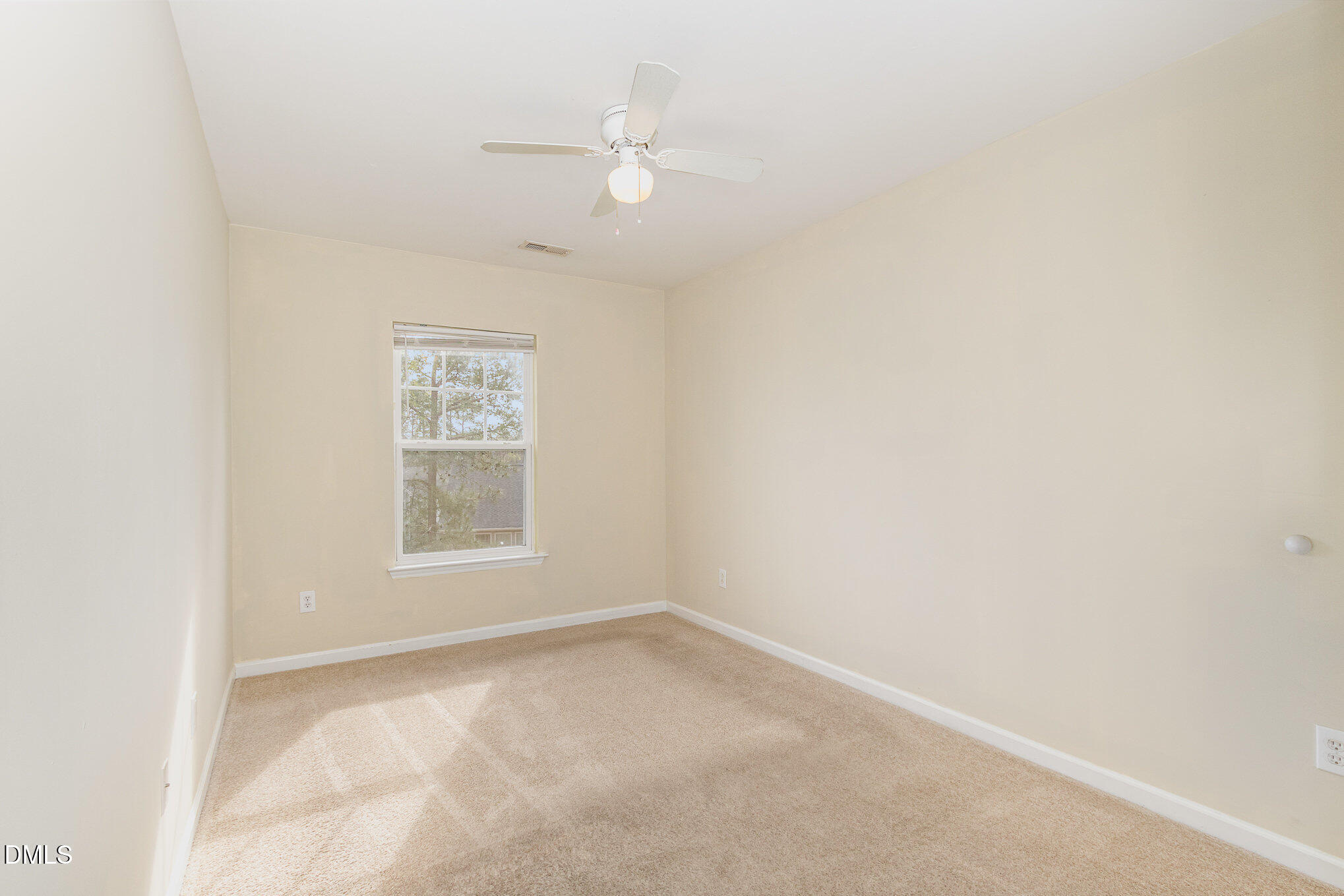 1311 Canyon Rock Court, Unit U105 Raleigh, NC 27610 - Photo 11 of 16 an empty room with a window