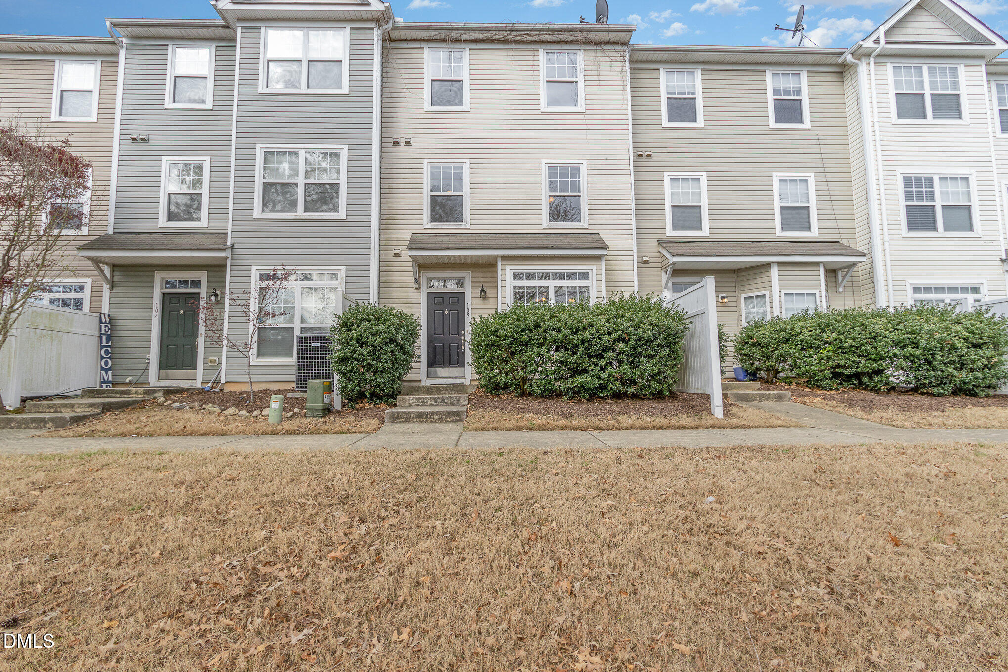1311 Canyon Rock Court, Unit U105 Raleigh, NC 27610 - Photo 15 of 16 front view of a house with a yard