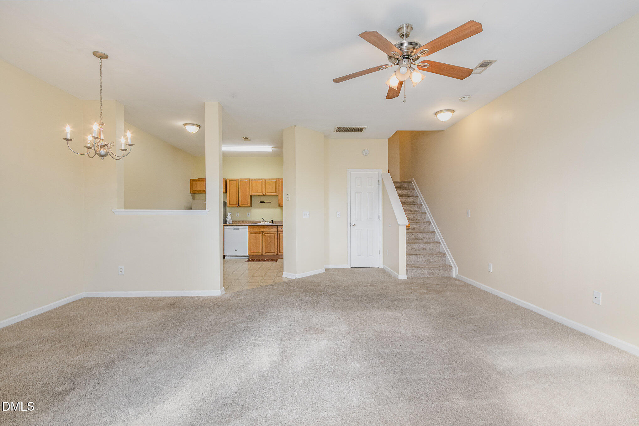 1311 Canyon Rock Court, Unit U105 Raleigh, NC 27610 - Photo 3 of 16 a view of an empty room with a kitchen
