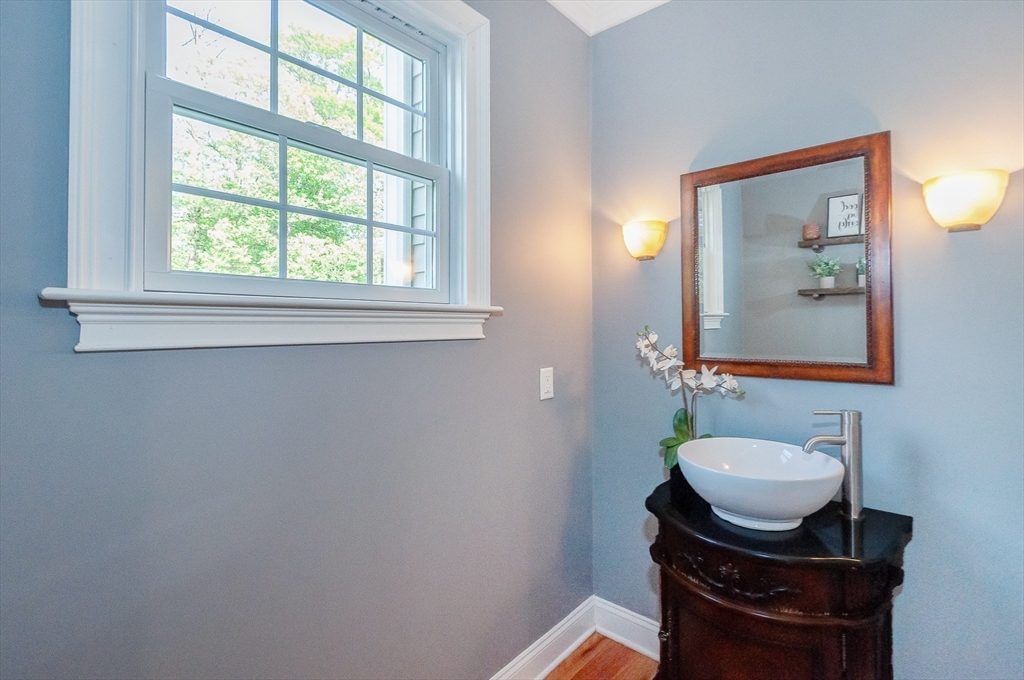 248 Alley Road Rochester, MA 02770 - Photo 15 of 39 a bathroom with a sink mirror and a toilet