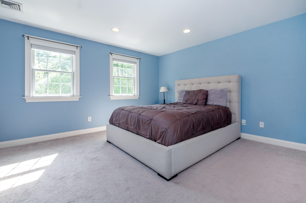248 Alley Road Rochester, MA 02770 - Photo 26 of 39 a spacious bedroom with a bed and window