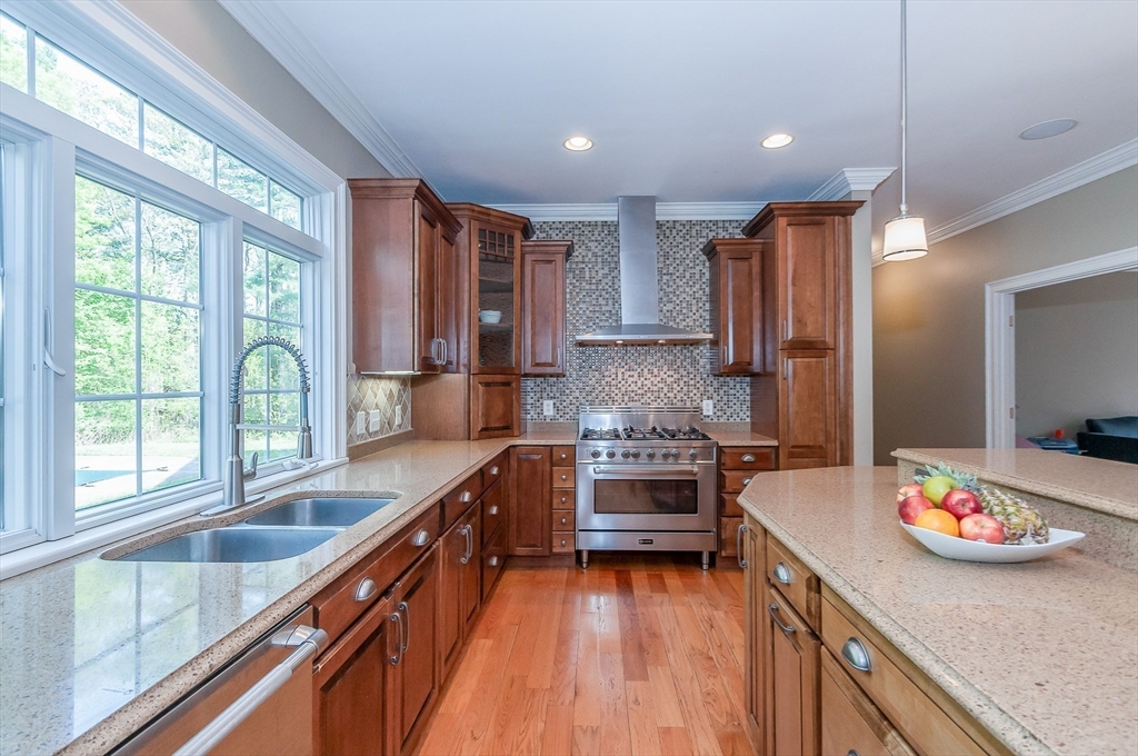 248 Alley Road Rochester, MA 02770 - Photo 8 of 39 a kitchen with stainless steel appliances a stove sink and cabinets