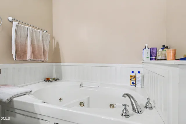 a bathroom with a bathtub and a sink