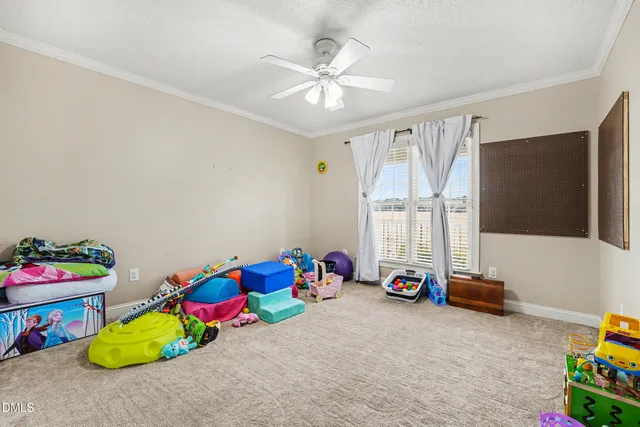 a children room with toys and a chandelier
