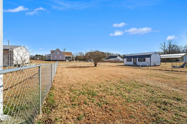 a view of residential houses with outdoor space