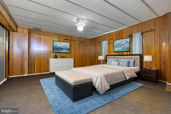 a room with flat screen tv and stove