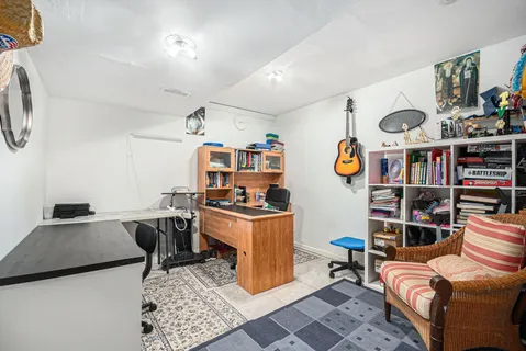 a view of a workspace with furniture and toys