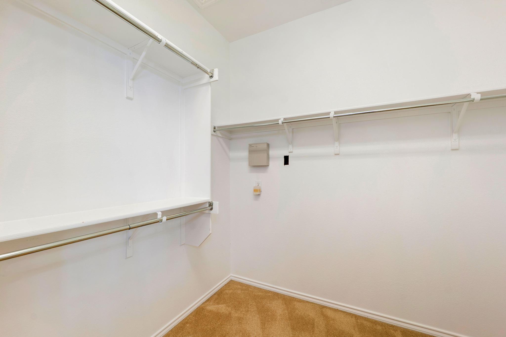 520 Mill Pond Path Georgetown, TX 78633 - Photo 28 of 38 Functional design with ample primary closet and easy-care carpeting provides everyday convenience.