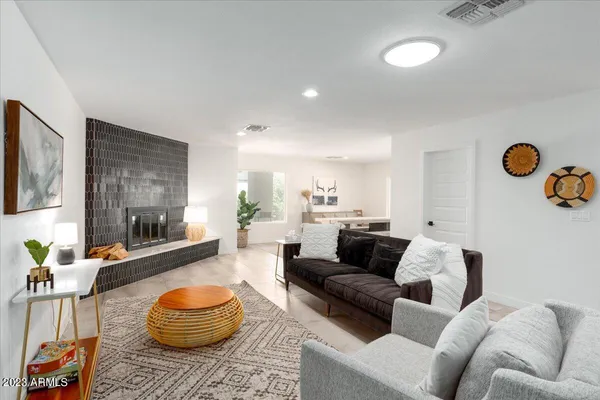 a living room with furniture and a rug