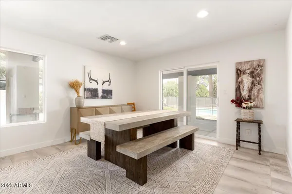 a view of living room with furniture and window