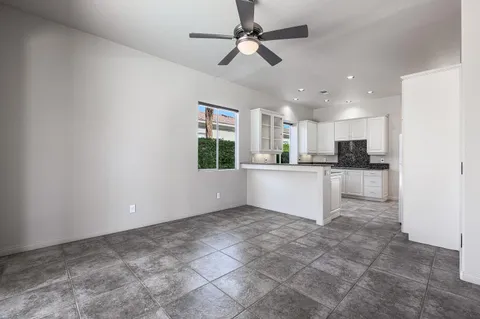 a view of a kitchen with a sink and cabinets