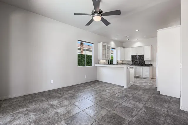 a view of a kitchen with a sink and cabinets