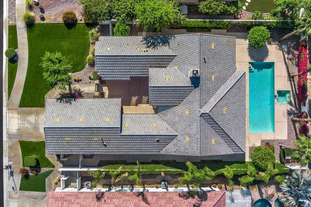 an aerial view of a house with a garden