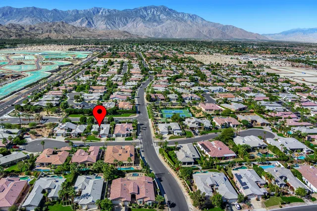 an aerial view of residential houses and outdoor space