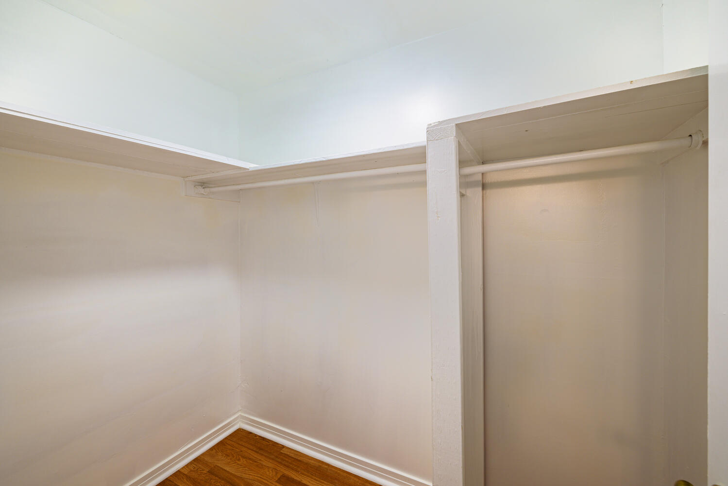 1400 Ruth Avenue Austin, TX 78757 - Photo 24 of 29 Hardwood flooring and built-in shelving maximize organization within this walk-in closet.
