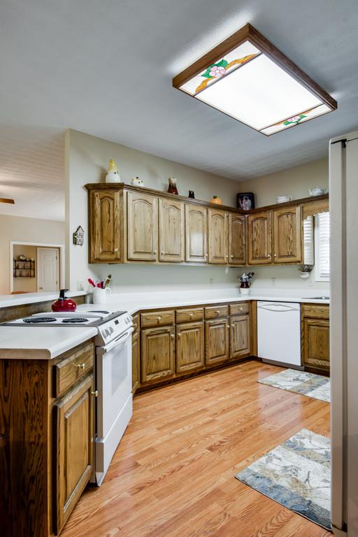 50 Beasley Bend Road Riddleton, TN 37151 - Photo 14 of 30 a kitchen with a stove top oven sink and cabinets