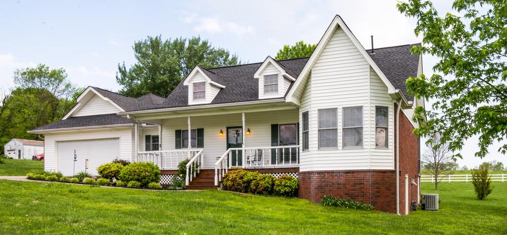 50 Beasley Bend Road Riddleton, TN 37151 - Photo 2 of 30 a view of a house with a yard and potted plants