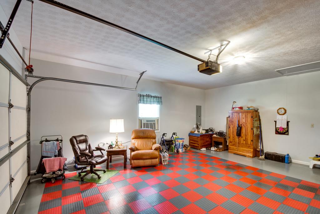 50 Beasley Bend Road Riddleton, TN 37151 - Photo 26 of 30 a bedroom with furniture and a gym equipment