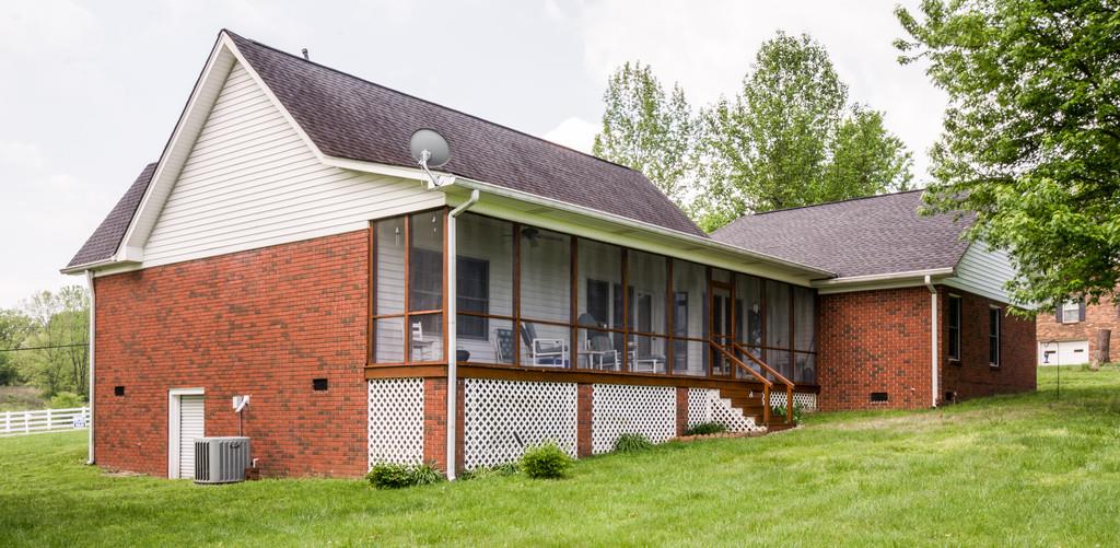 50 Beasley Bend Road Riddleton, TN 37151 - Photo 29 of 30 a front view of a house with a garden and yard