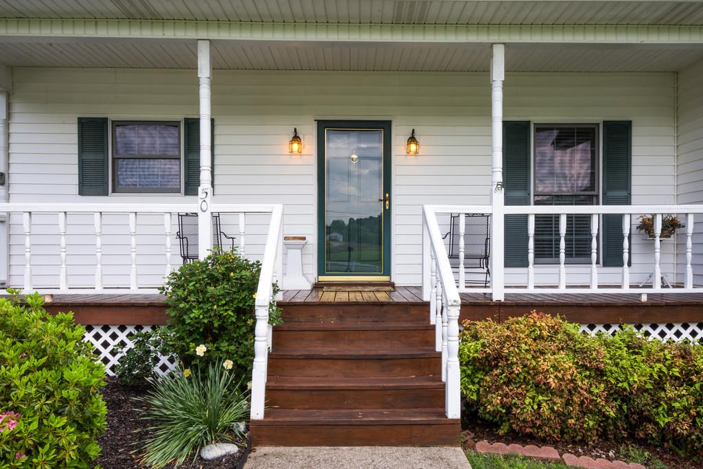 50 Beasley Bend Road Riddleton, TN 37151 - Photo 5 of 30 a front view of a house with a garden